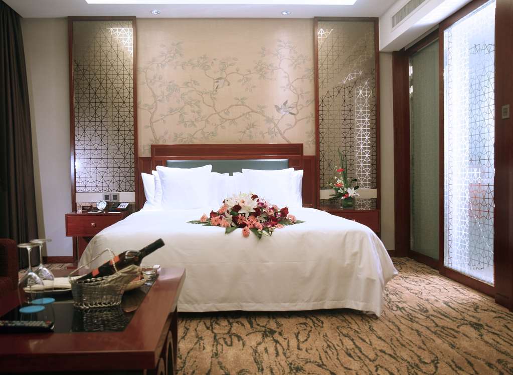 Gloria Grand Hotel Wuxi Уси Номер фото